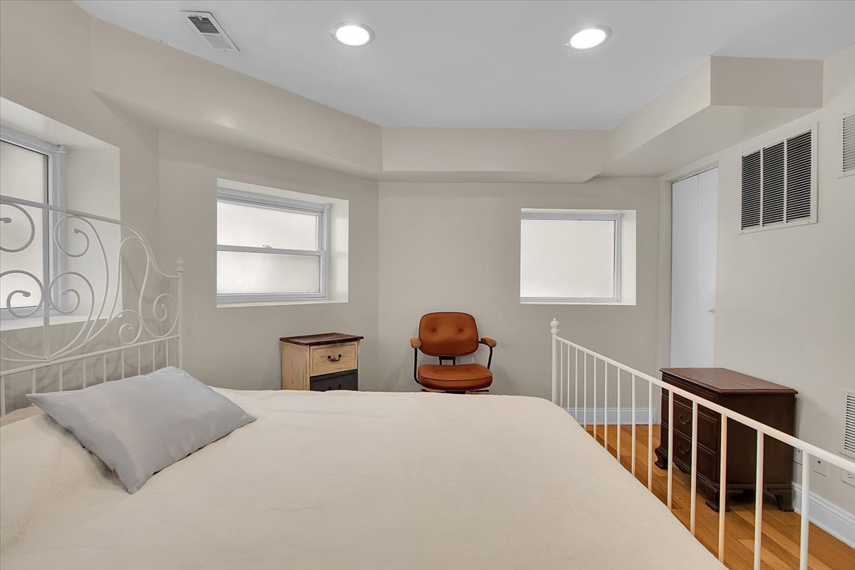 1647 West Sherwin Avenue, Unit 1 Chicago, IL 60626 - Photo 13 of 22 a bedroom with a bed and window