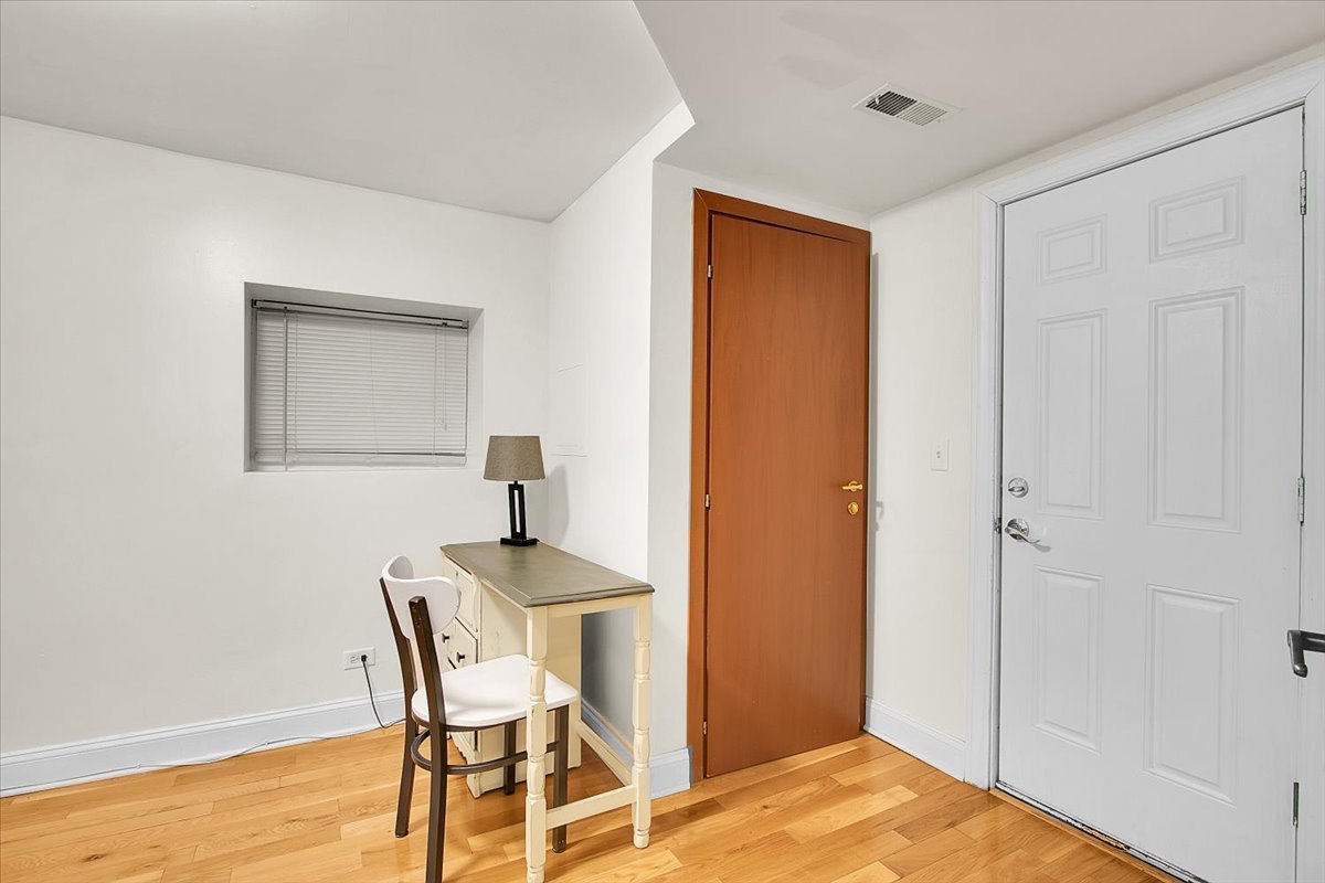 1647 West Sherwin Avenue, Unit 1 Chicago, IL 60626 - Photo 16 of 22 a workspace with furniture and a window