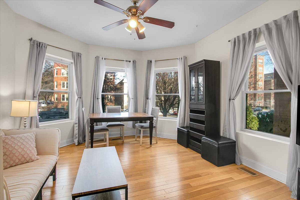1647 West Sherwin Avenue, Unit 1 Chicago, IL 60626 - Photo 3 of 22 a living room with furniture and a window