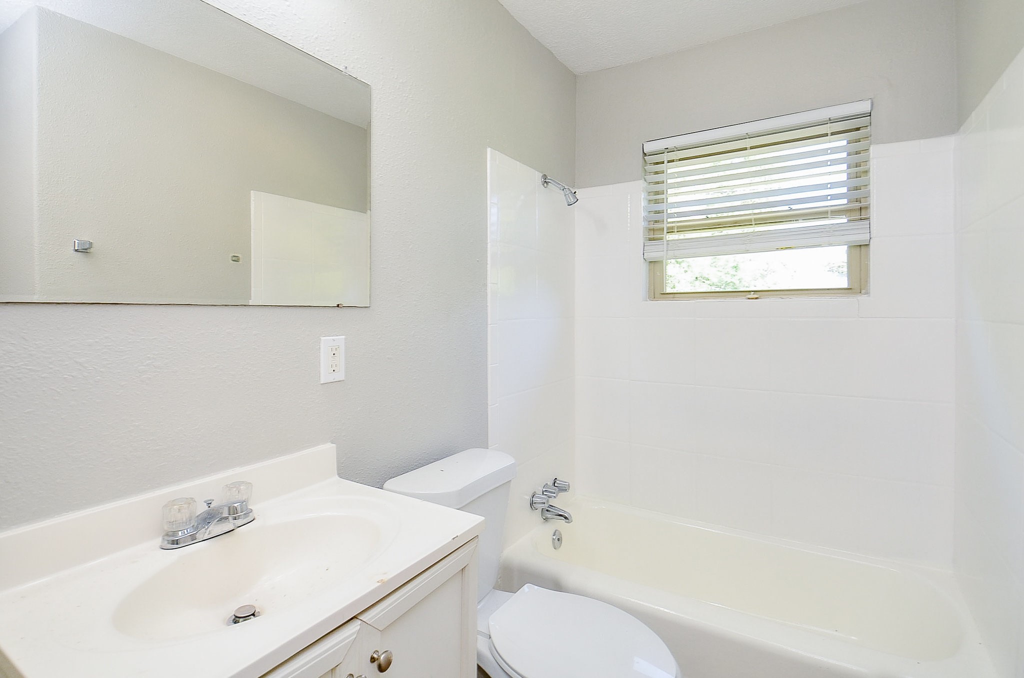5405 Southlea Street Houston, TX 77033 - Photo 23 of 32 a bathroom with a sink toilet and shower