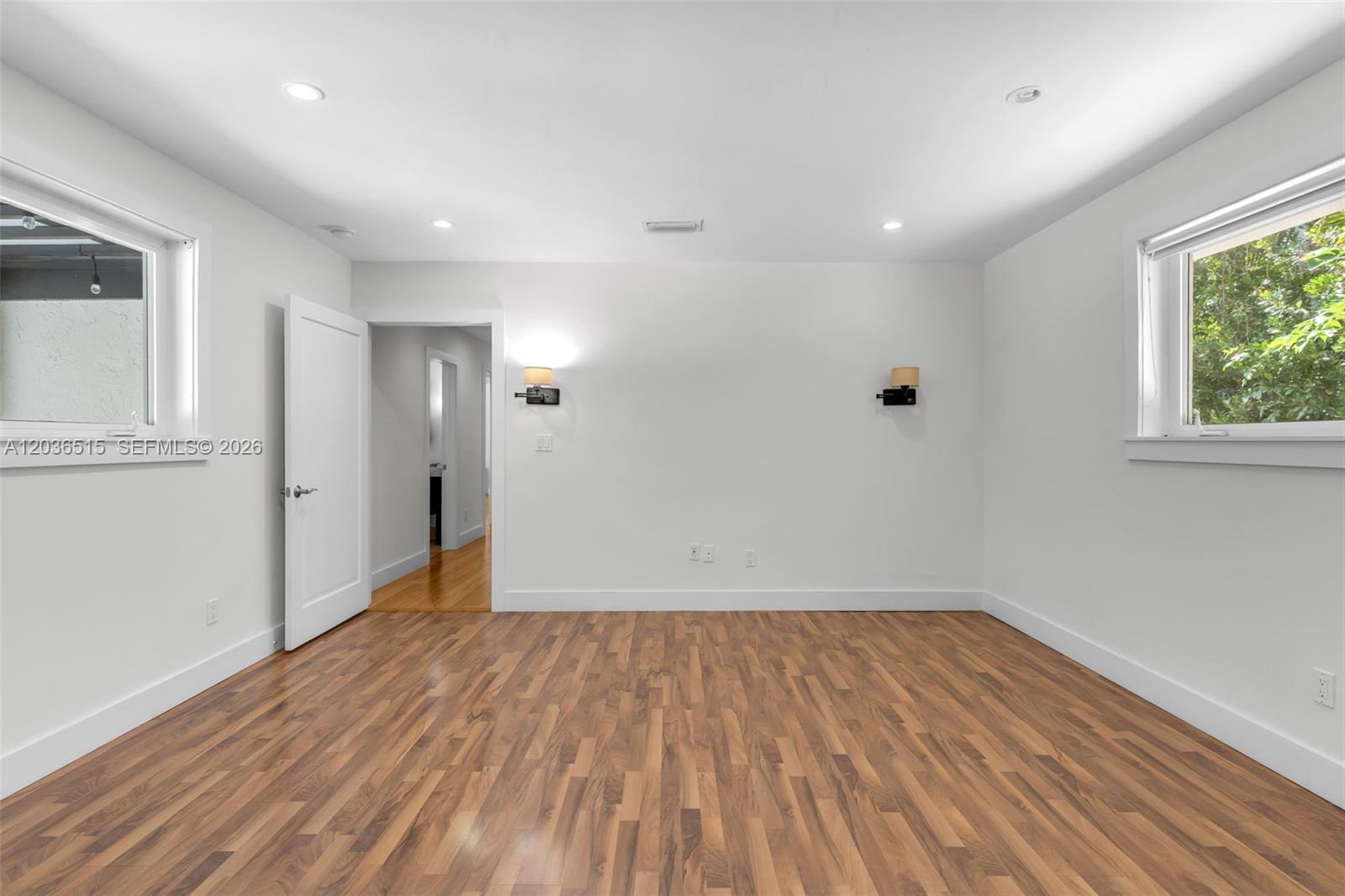 7711 Erwin Road Coral Gables, FL 33143 - Photo 17 of 26 a view of a room with wooden floor and window