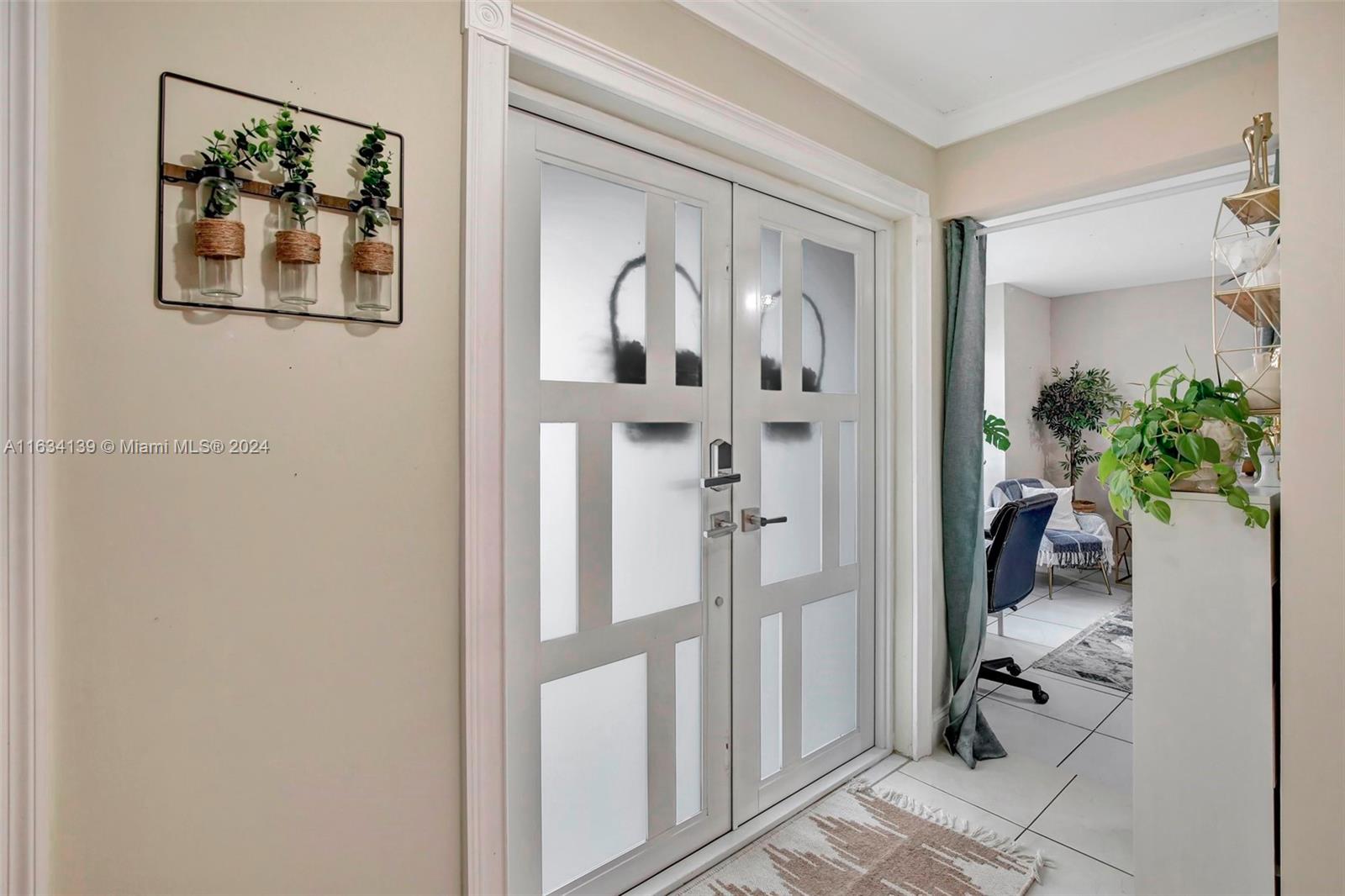 2860 Huron Way Miramar, FL 33025 - Photo 22 of 57 a view of a hallway with paintings on the wall