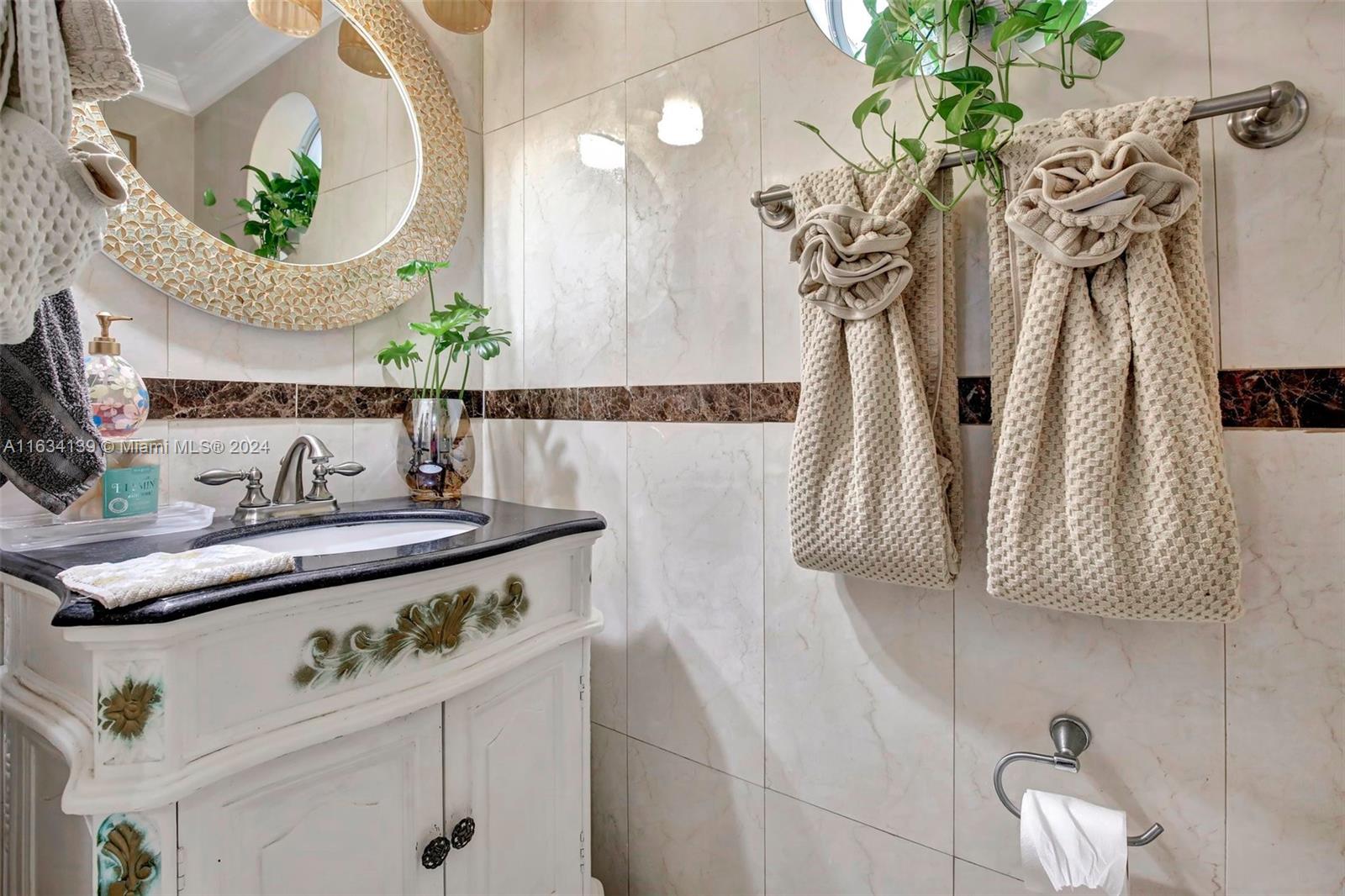 2860 Huron Way Miramar, FL 33025 - Photo 23 of 57 a view of a bathroom with a sink and mirror