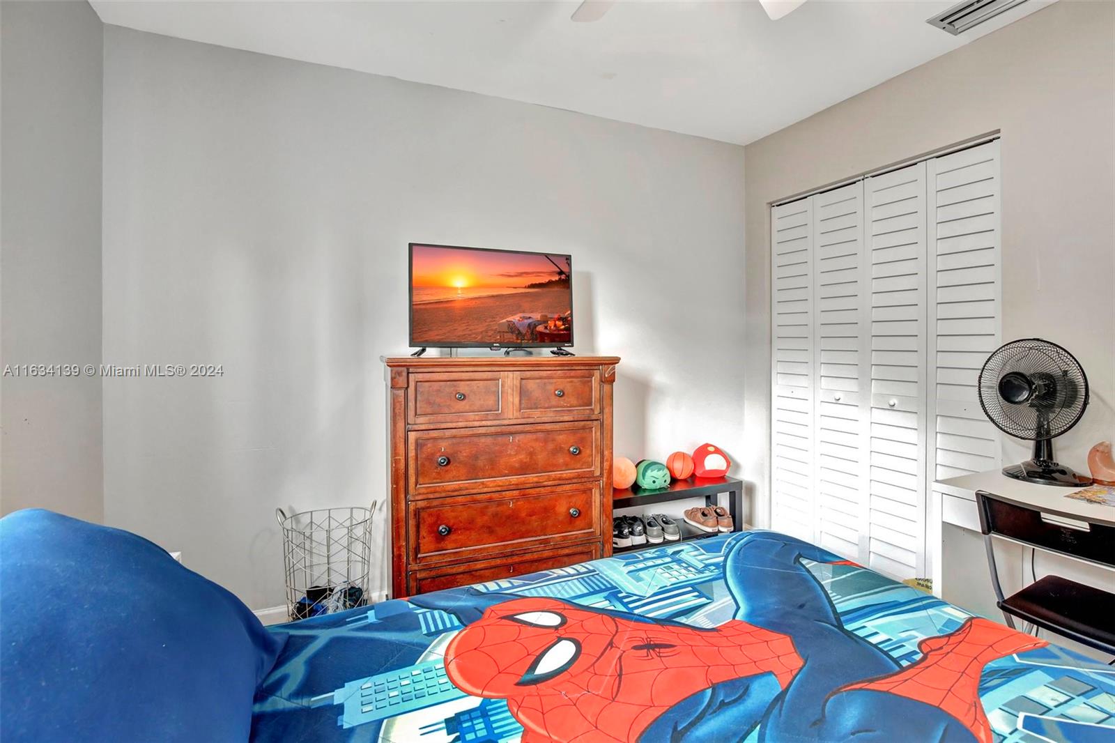 2860 Huron Way Miramar, FL 33025 - Photo 30 of 57 a living room with furniture and a flat screen tv