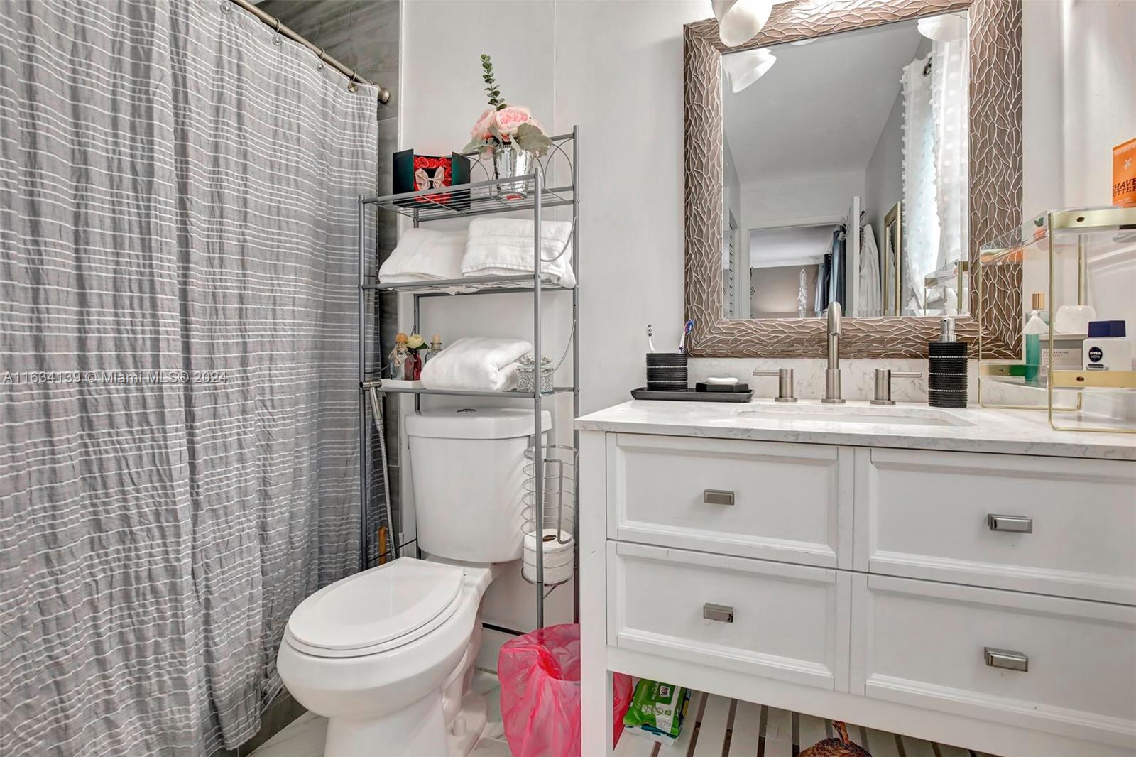 2860 Huron Way Miramar, FL 33025 - Photo 37 of 57 a bathroom with a sink toilet and shower