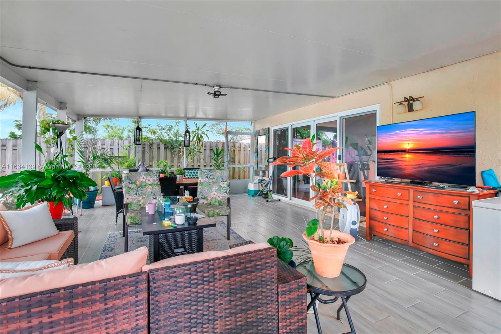 2860 Huron Way Miramar, FL 33025 - Photo 43 of 57 a living room with furniture and a flat screen tv