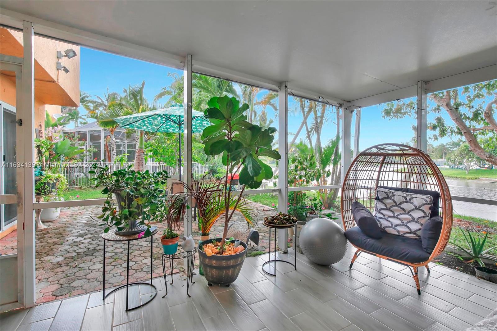 2860 Huron Way Miramar, FL 33025 - Photo 45 of 57 a living room with furniture and a potted plant