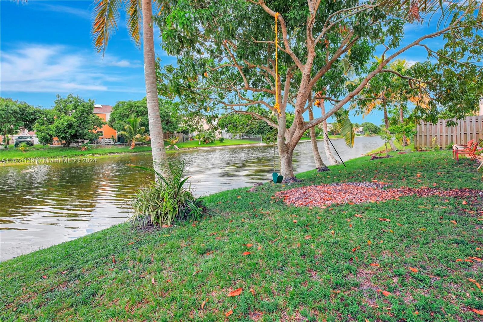 2860 Huron Way Miramar, FL 33025 - Photo 50 of 57 a view of a garden with a lake