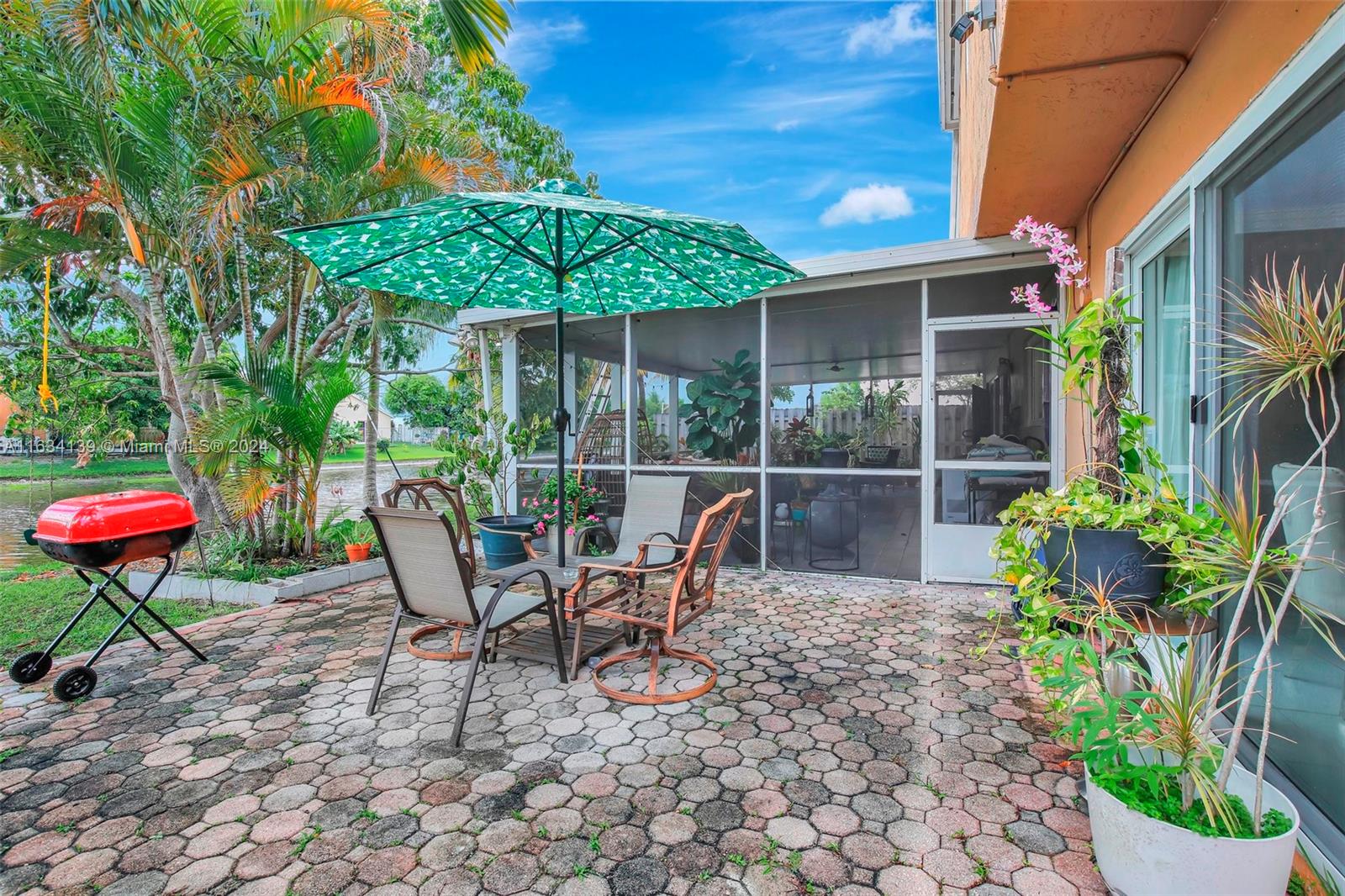 2860 Huron Way Miramar, FL 33025 - Photo 51 of 57 a view of a chairs and table in the patio