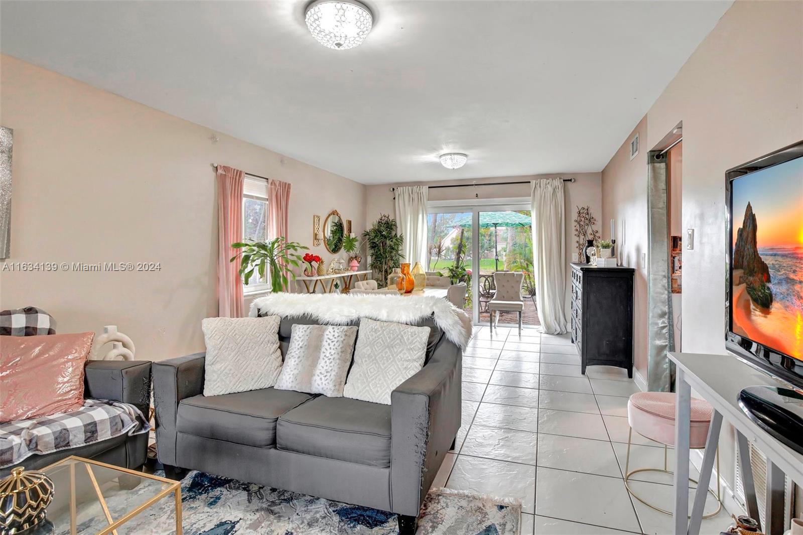 2860 Huron Way Miramar, FL 33025 - Photo 6 of 57 a living room with furniture and a flat screen tv