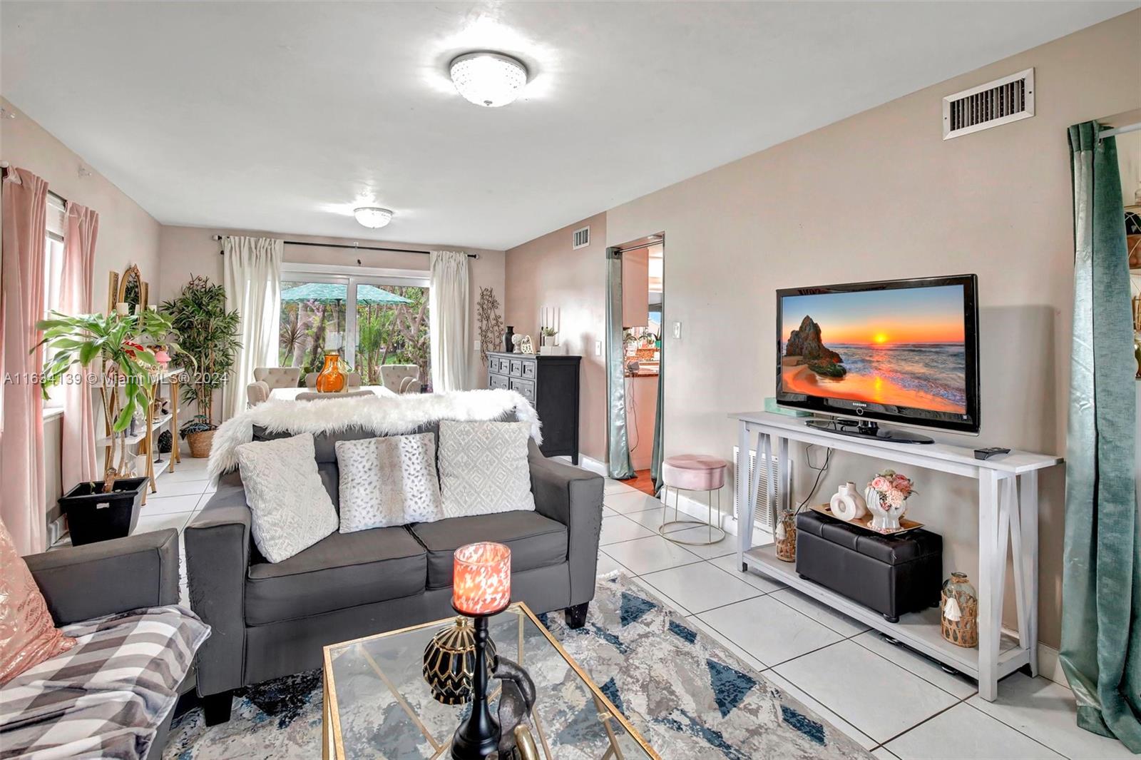 2860 Huron Way Miramar, FL 33025 - Photo 7 of 57 a living room with furniture and a flat screen tv