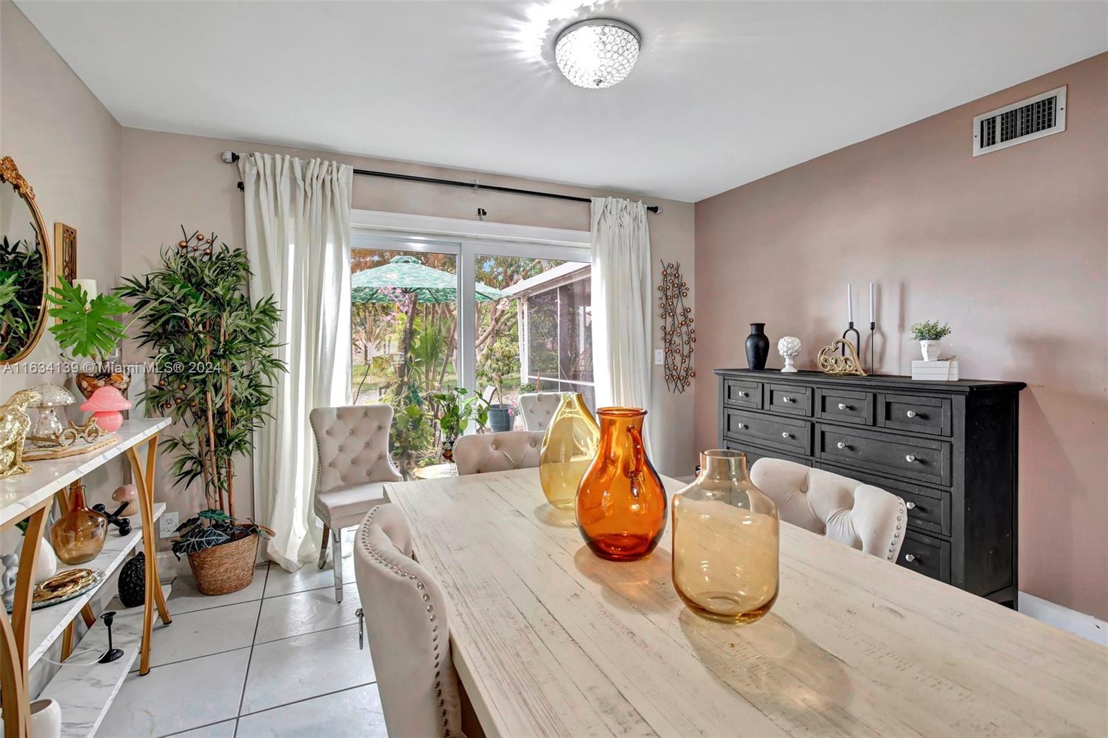 2860 Huron Way Miramar, FL 33025 - Photo 9 of 57 a living room with furniture and a potted plant