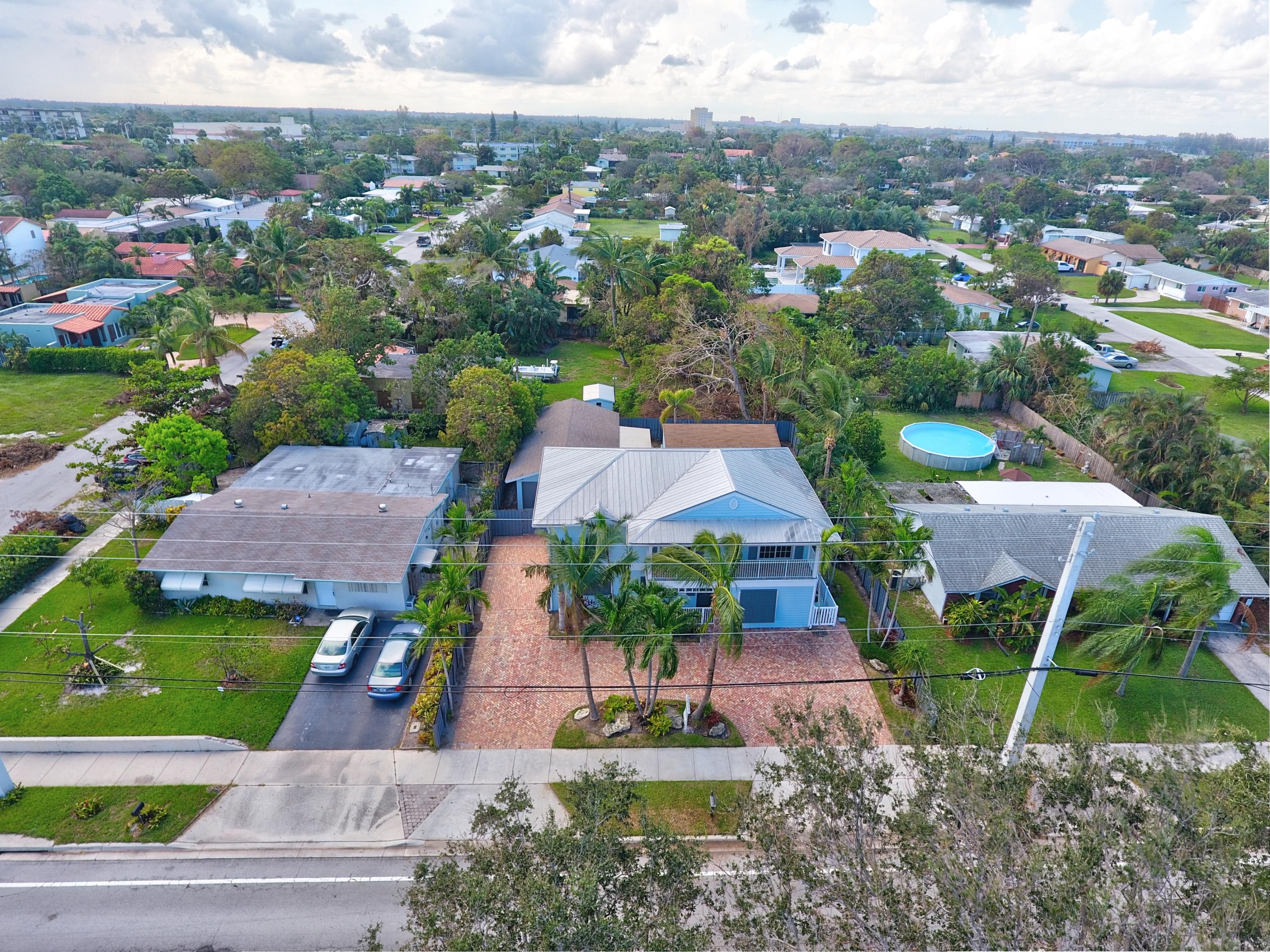 805 Northwest 2nd Avenue Boca Raton, FL 33432 - Photo 48 of 56 an aerial view of multiple houses with a yard