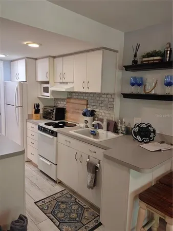 $1,400 | 1983 Abrico Drive, Unit H13, Lutz, FL 33558