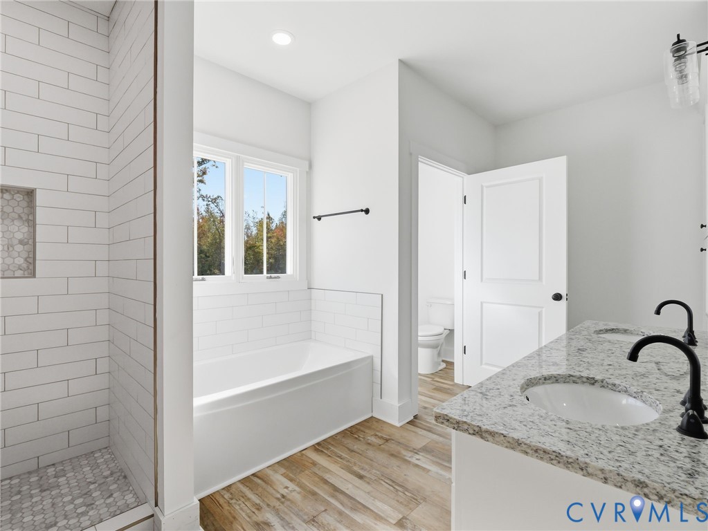 3706 Broad St Road Gum Spring, VA 23065 - Photo 25 of 34 a bathroom with a granite countertop sink and a mirror