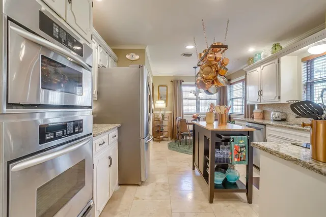 a kitchen with a sink cabinets and window