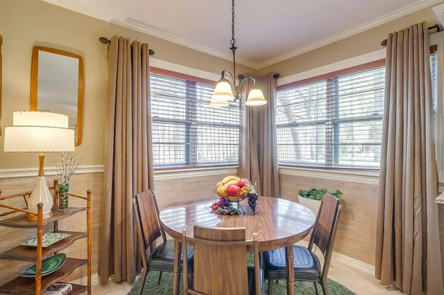 a view of a dining room with furniture window and outside view