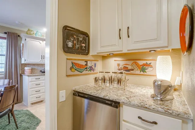 a kitchen with appliances and cabinets