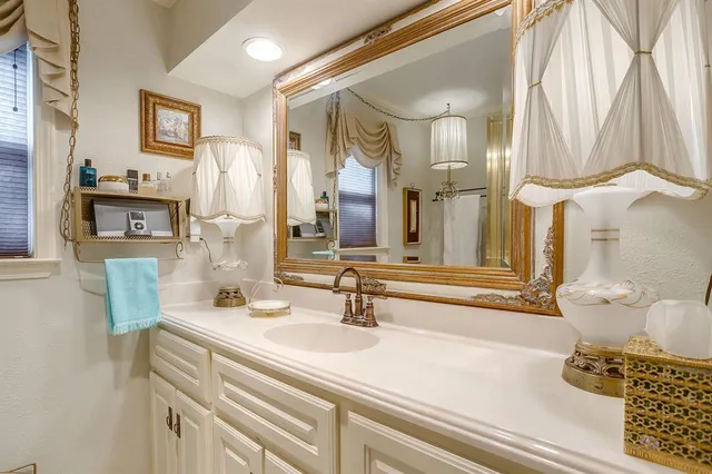 a bathroom with a double vanity sink and a mirror