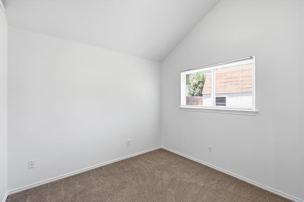 209 Rodeo Drive Keller, TX 76248 - Photo 17 of 26 Vaulted ceiling room with neutral carpet