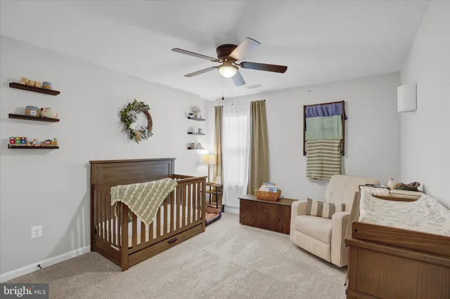 a bedroom with furniture and window