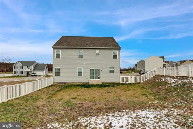 a view of a kitchen with a sink and cabinets