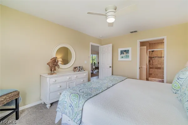 a bedroom with a bed and a table