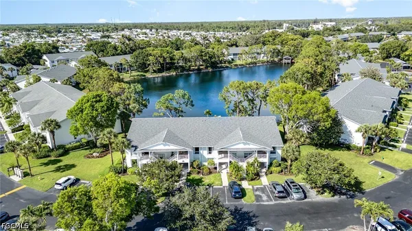 an aerial view of a house with a lake view