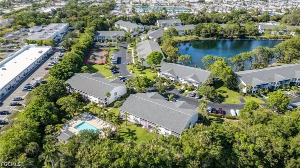 an aerial view of a house with a lake view