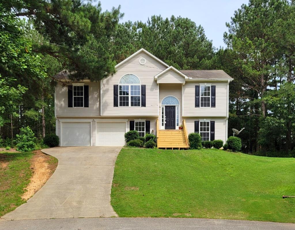 a front view of a house with a yard