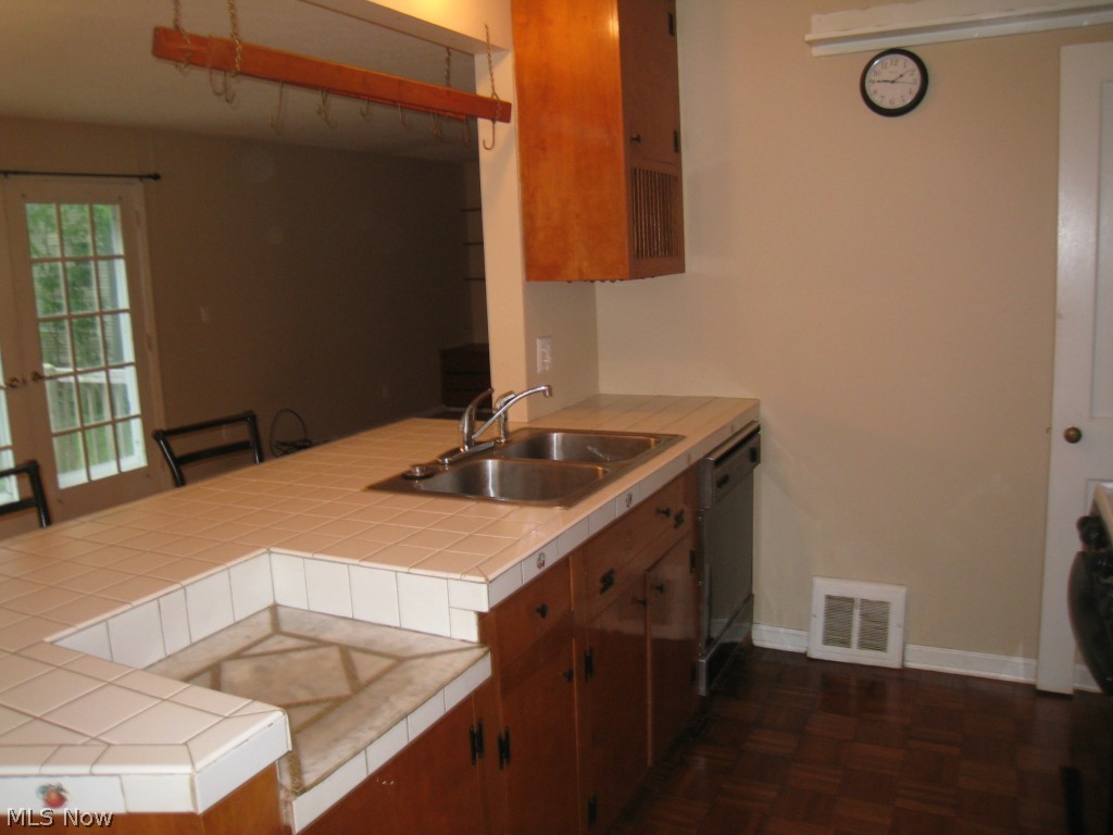 4674 Liberty Road South Euclid, OH 44121 - Photo 7 of 18 Kitchen counter, wood cabinets and wood floor.