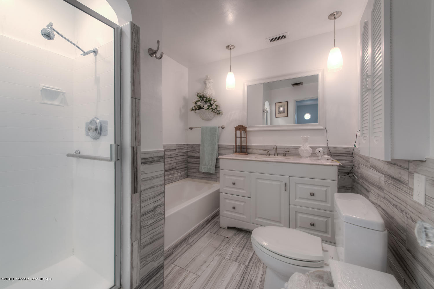 1900 Montecito Drive Glendale, CA 91208 - Photo 13 of 30 a bathroom with a granite countertop toilet sink and shower
