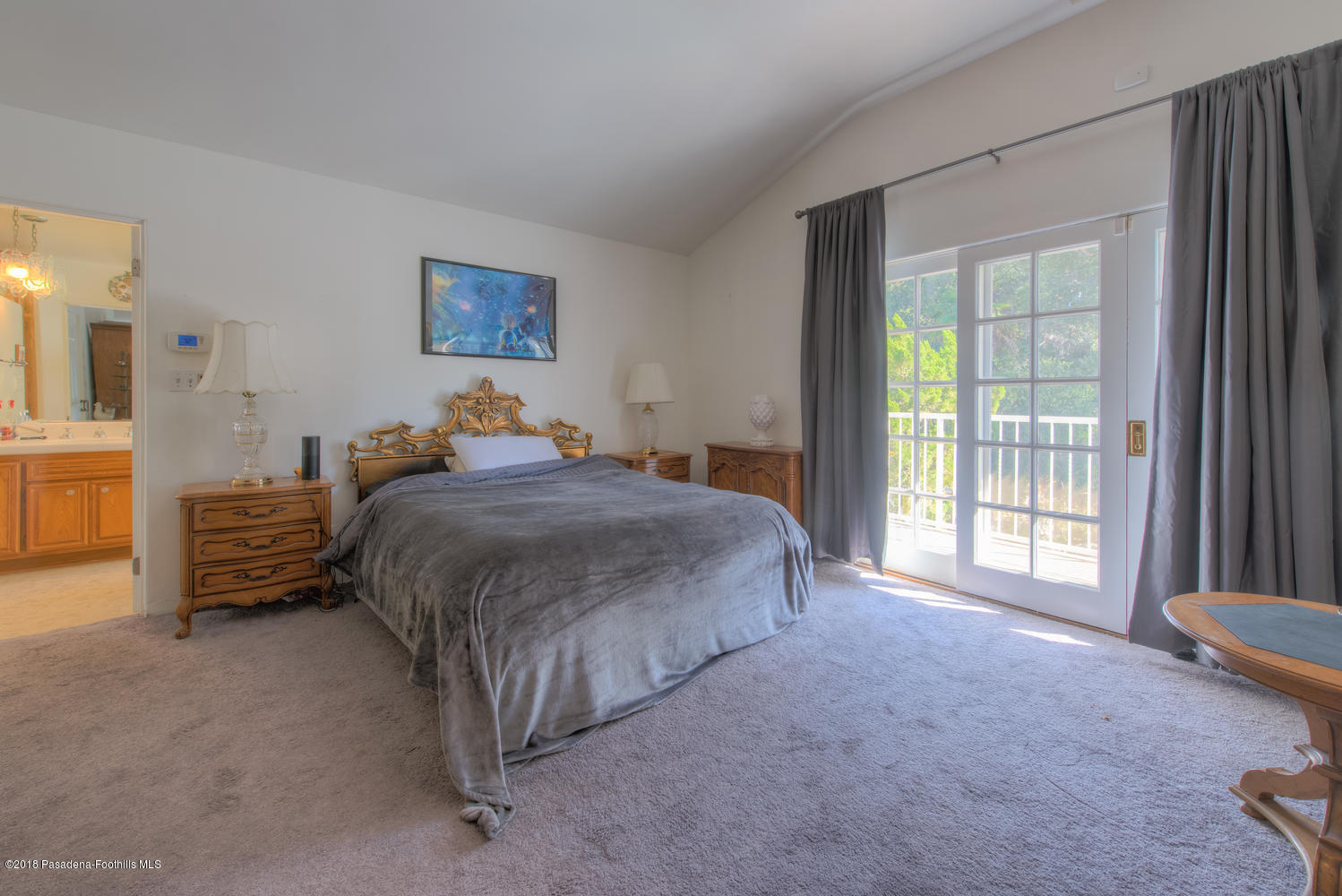 1900 Montecito Drive Glendale, CA 91208 - Photo 15 of 30 a spacious bedroom with a bed and a large window