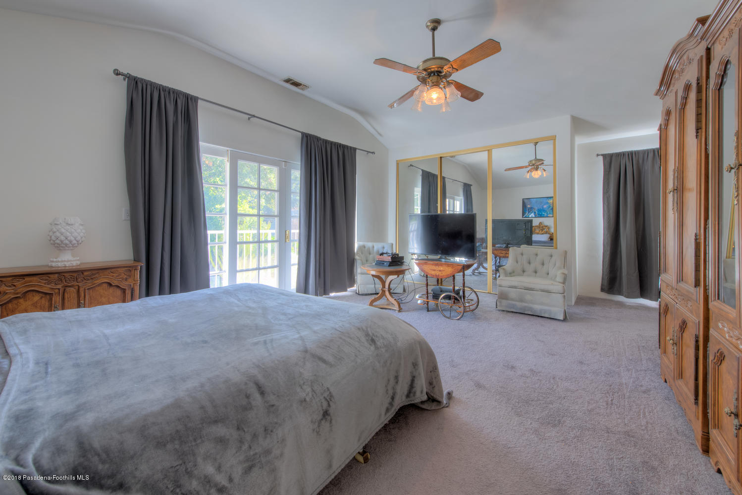 1900 Montecito Drive Glendale, CA 91208 - Photo 16 of 30 a bed room with a bed and a chair