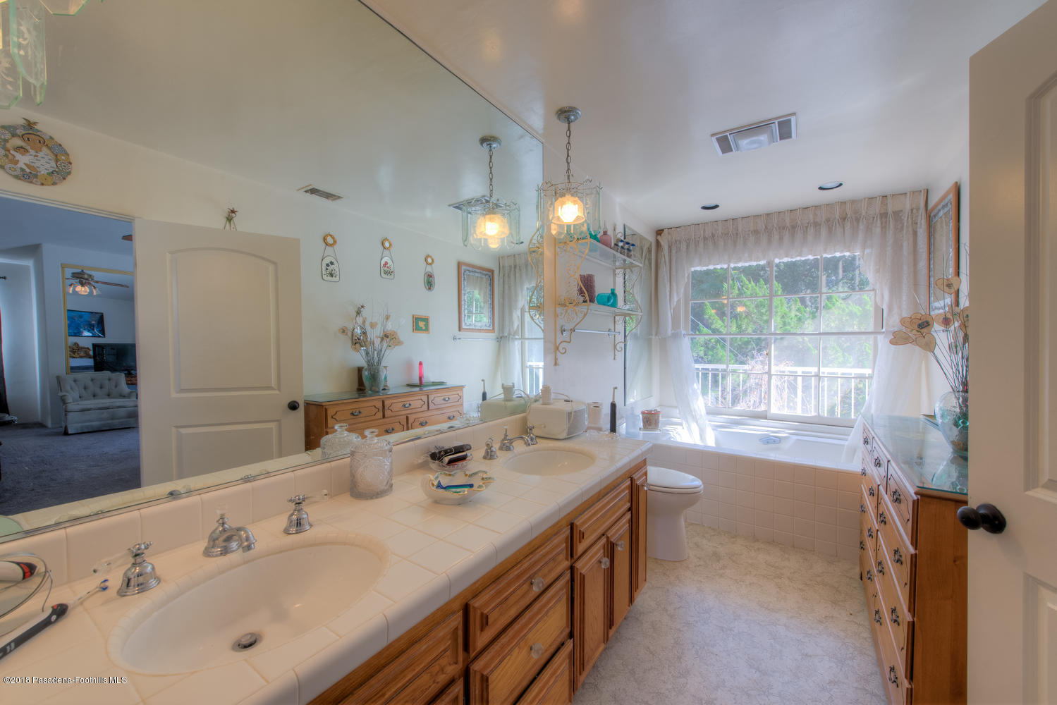 1900 Montecito Drive Glendale, CA 91208 - Photo 17 of 30 a spacious bathroom with double vanity and a mirror
