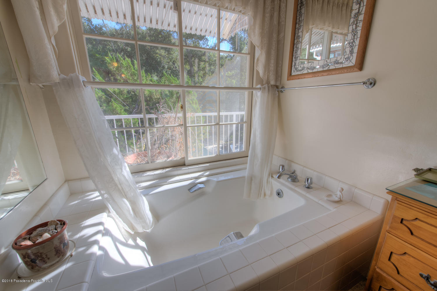 1900 Montecito Drive Glendale, CA 91208 - Photo 18 of 30 a bath tub sitting next to a window