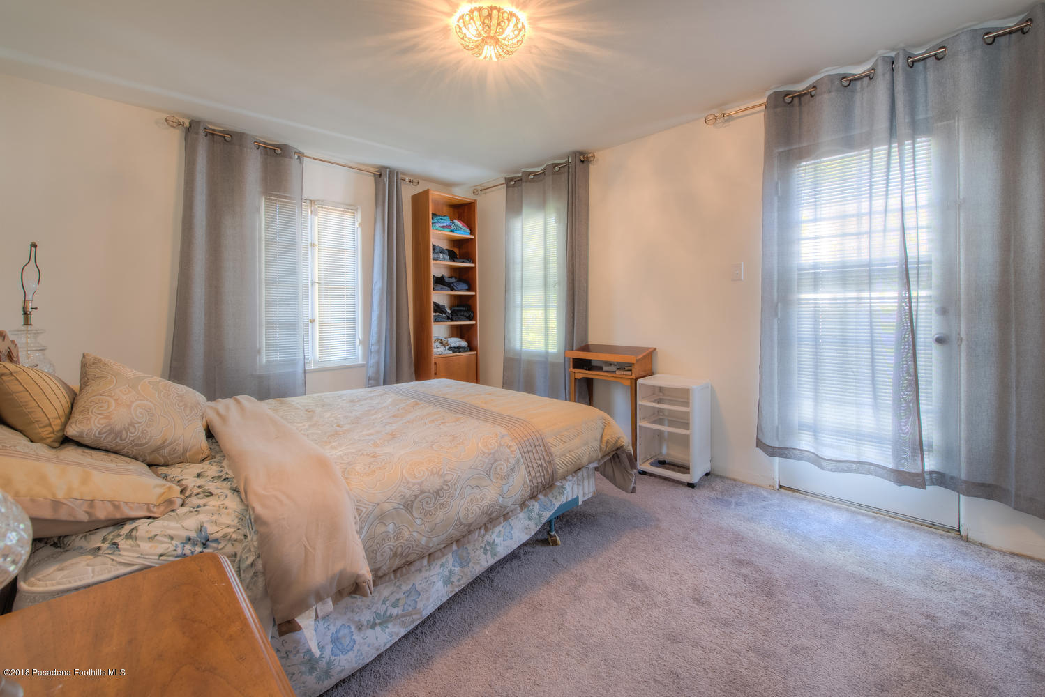 1900 Montecito Drive Glendale, CA 91208 - Photo 20 of 30 a bedroom with a bed and a window