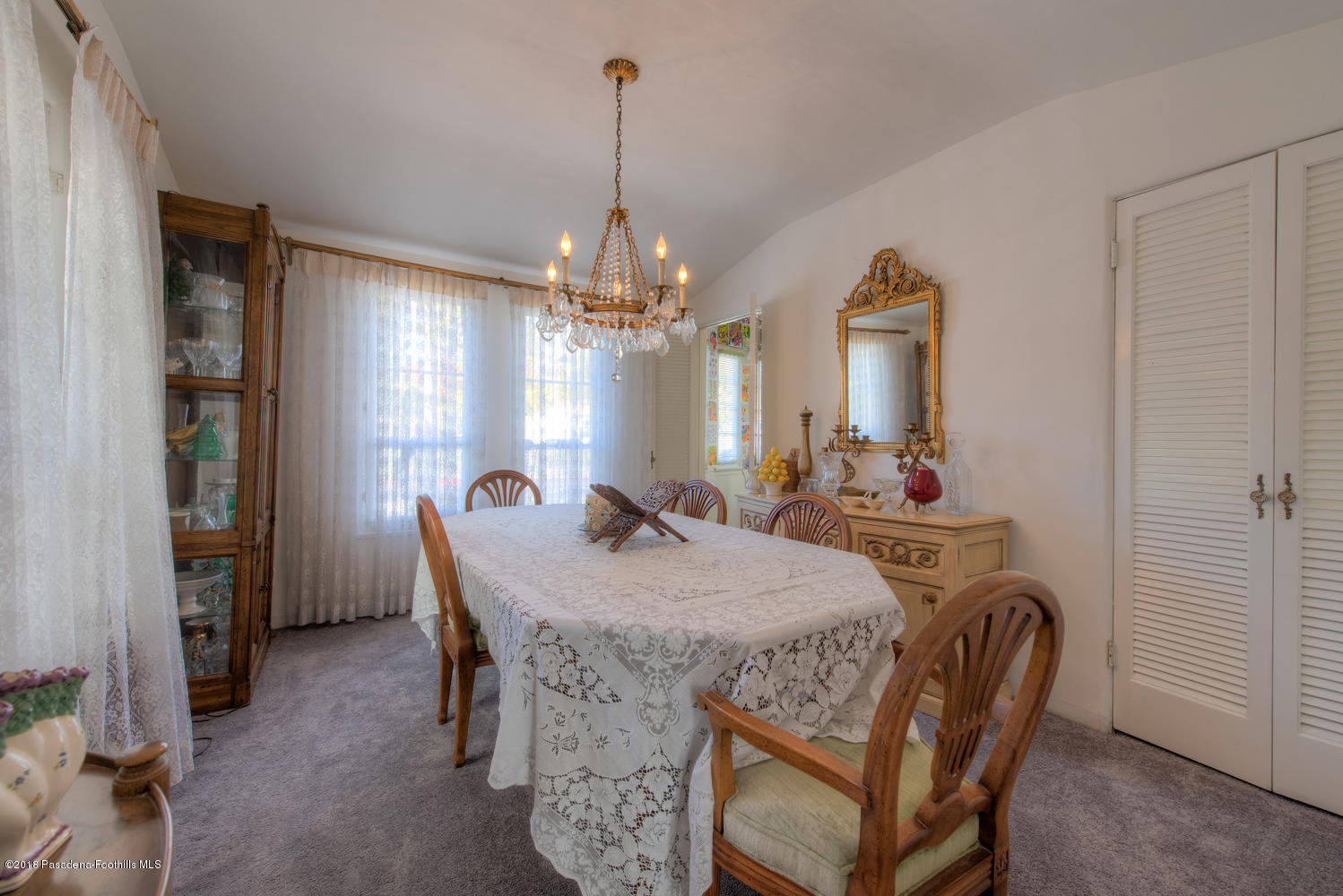 1900 Montecito Drive Glendale, CA 91208 - Photo 3 of 30 a view of a dining room with furniture and chandelier