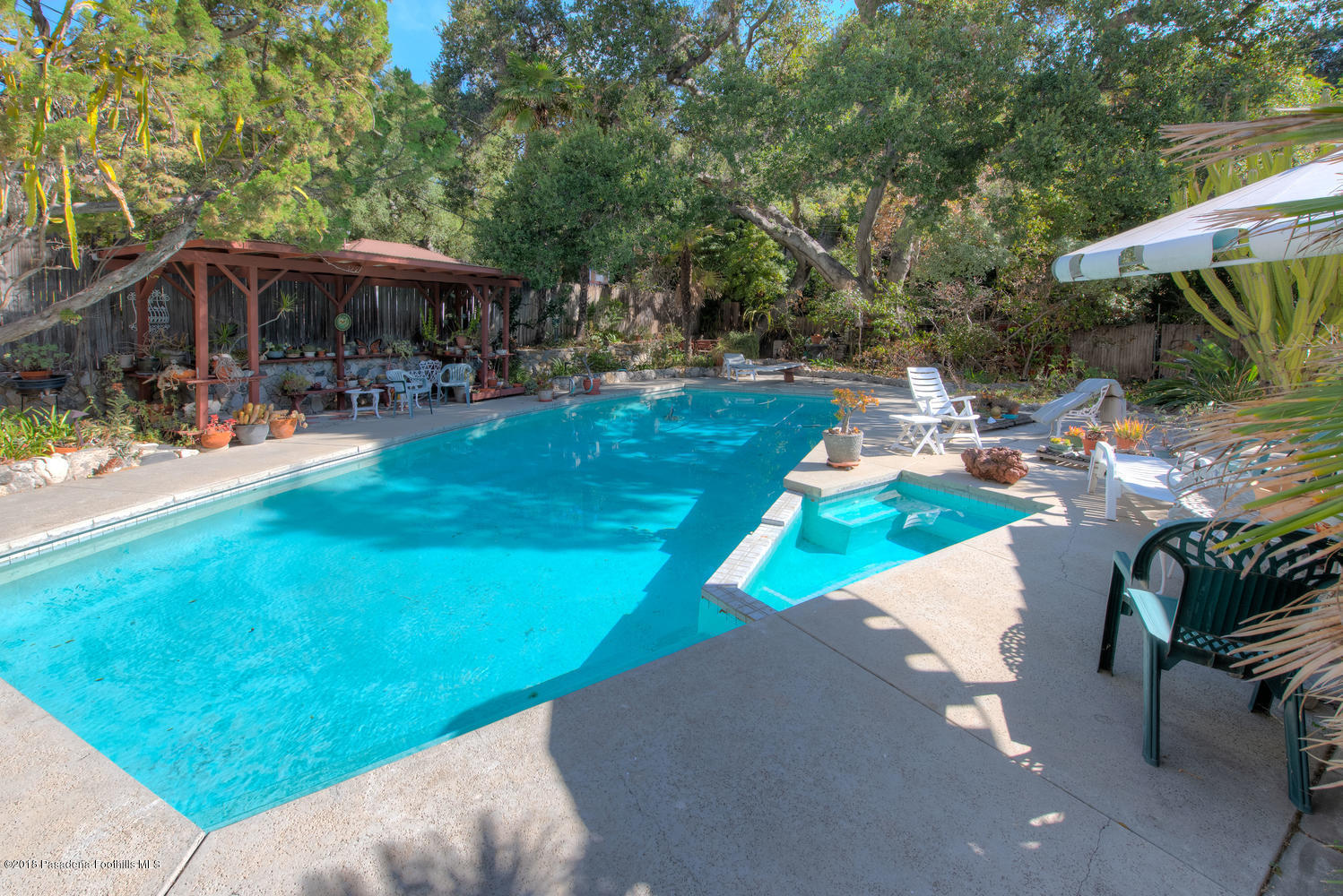 1900 Montecito Drive Glendale, CA 91208 - Photo 25 of 30 a view of patio with table and chairs under an umbrella