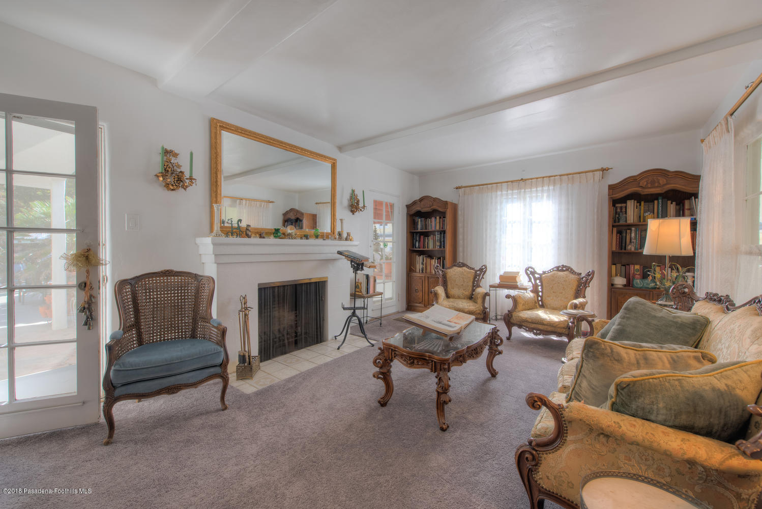 1900 Montecito Drive Glendale, CA 91208 - Photo 7 of 30 a living room with furniture and a fireplace