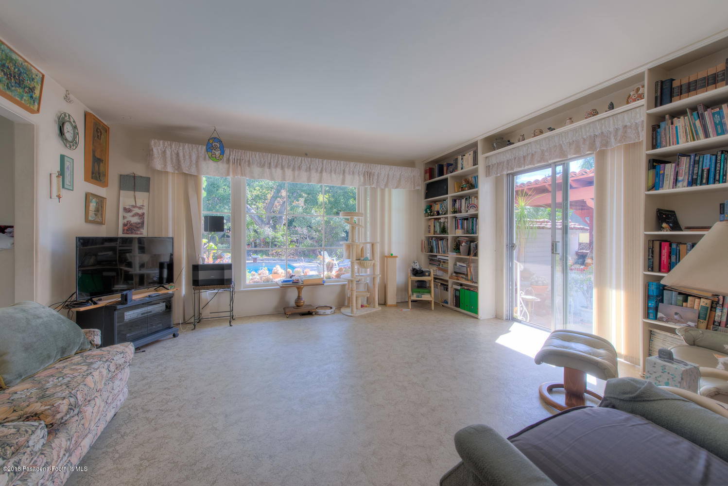 1900 Montecito Drive Glendale, CA 91208 - Photo 10 of 30 a living room with furniture and a flat screen tv