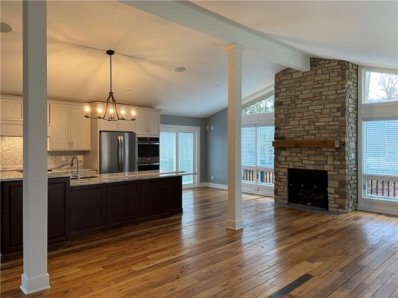 2245 Ridge Drive Mars, PA 16046 - Photo 5 of 15 Gorgeous stone, floor to ceiling fireplace with gas logs. Door to deck. Lots of windows!