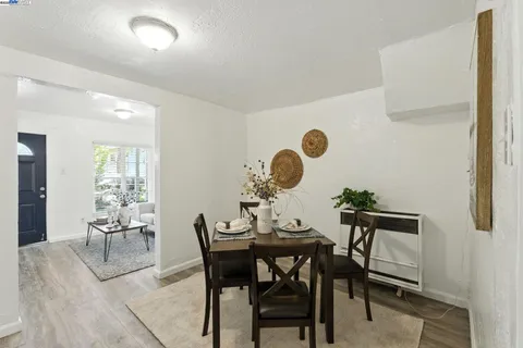 a kitchen with a refrigerator stove and white cabinets