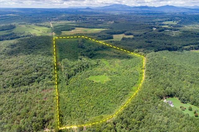 a view of lake with green field