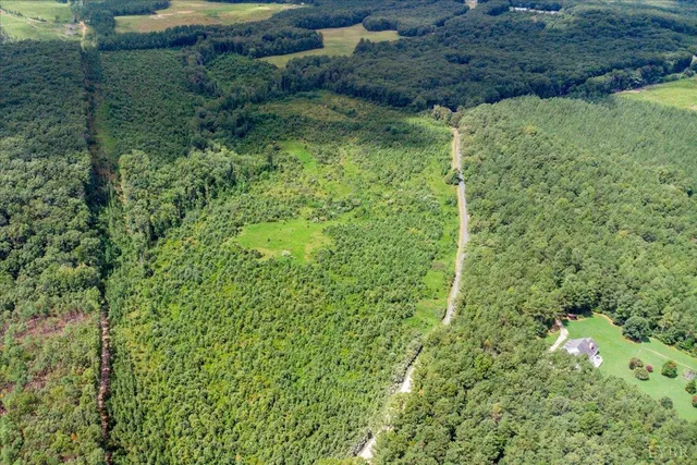a view of a garden with a building
