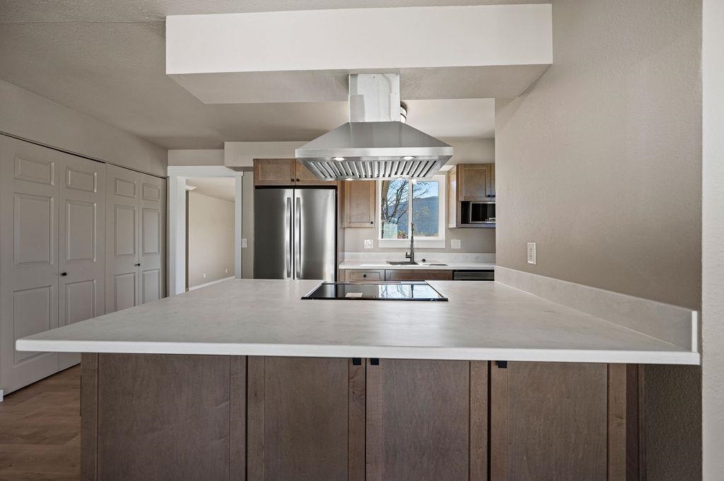 508 Rosa Street Palisade, CO 81526 - Photo 4 of 18 a kitchen with a stove a sink and a refrigerator