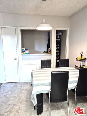 a kitchen with a sink cabinets and window