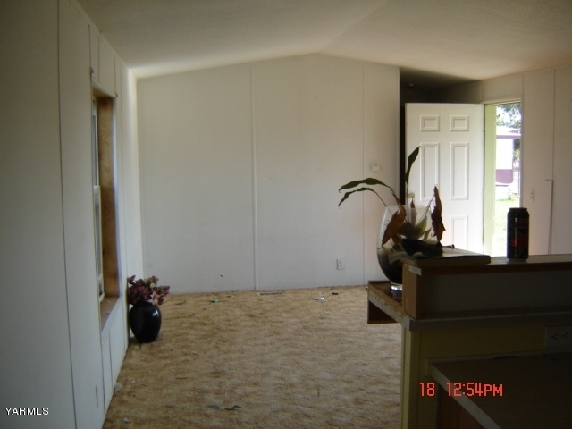 2802 Beaudry Road, Unit 61B Yakima, WA 98901 - Photo 1 of 1 a room with a table and a mirror
