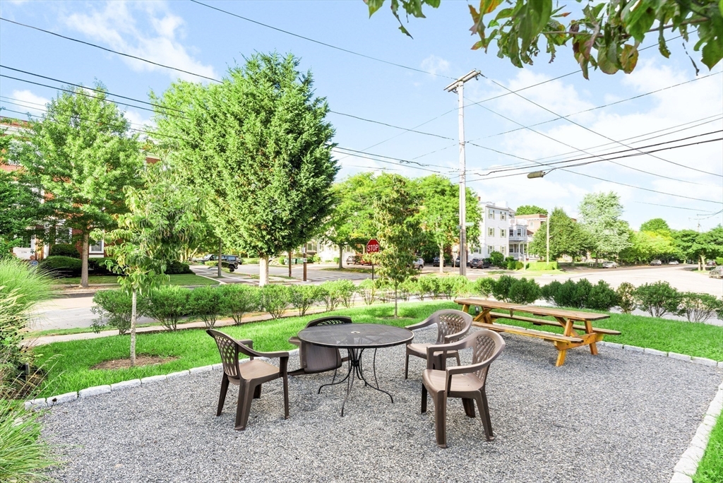 131 Irving Avenue, Unit 3 Providence, RI 02906 - Photo 13 of 14 a backyard of a house with outdoor seating