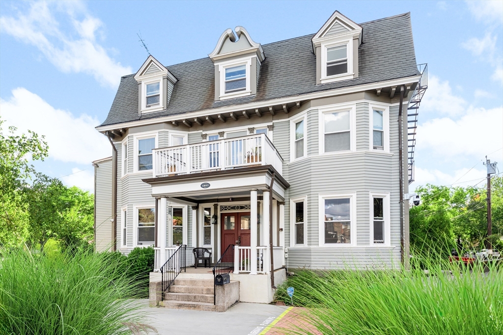 131 Irving Avenue, Unit 3 Providence, RI 02906 - Photo 3 of 14 front view of a house with a yard